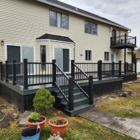 Chic wooden deck with built-in steps and contrasting railings, integrated into a contemporary home layout.