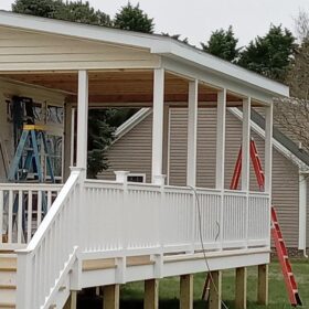 Covered porch with lattice skirting on a traditional home