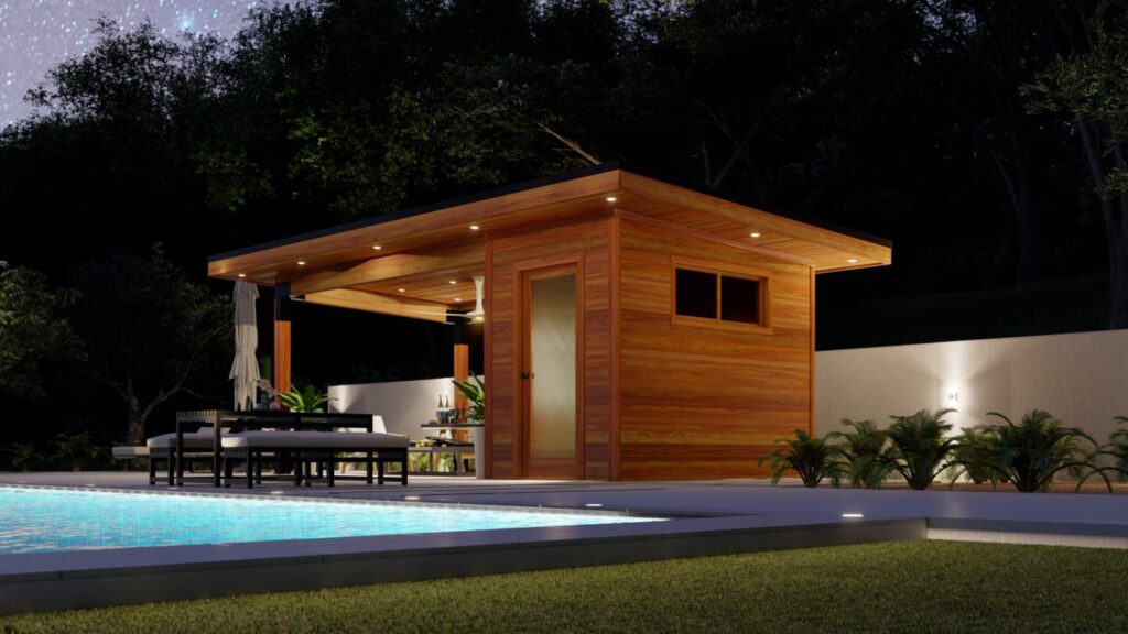 Modern cabana with lounge seating and curtains beside illuminated swimming pool at night.