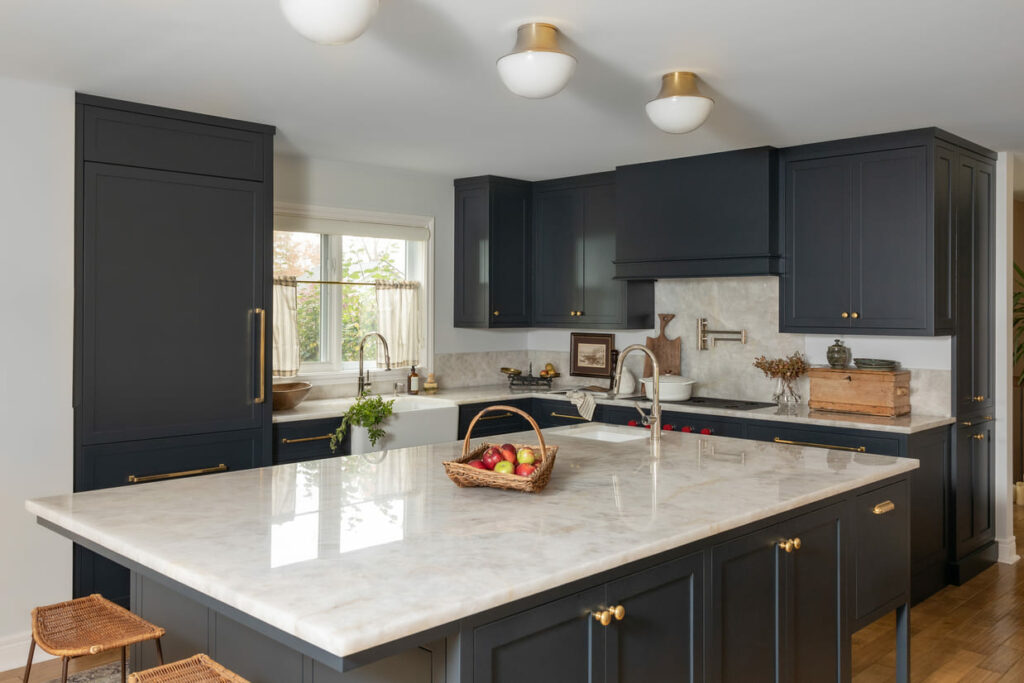 Modern kitchen renovation with custom cabinetry, quartz countertops, and upgraded lighting.