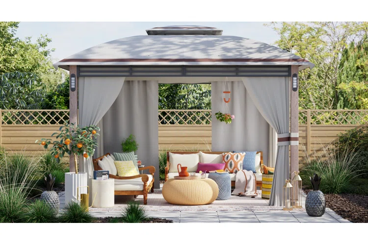 Modern backyard pavilion with curtains, cozy seating, and stylish outdoor decor