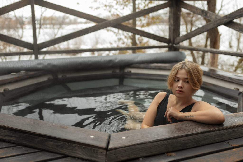 Modern pool and hot tub deck with seating area