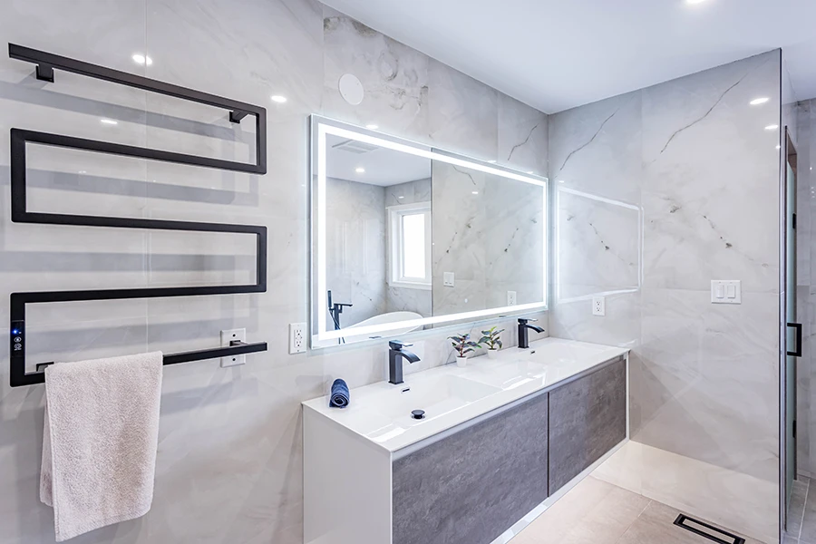 Modern bathroom renovation with glass shower, vanity, and updated fixtures.
